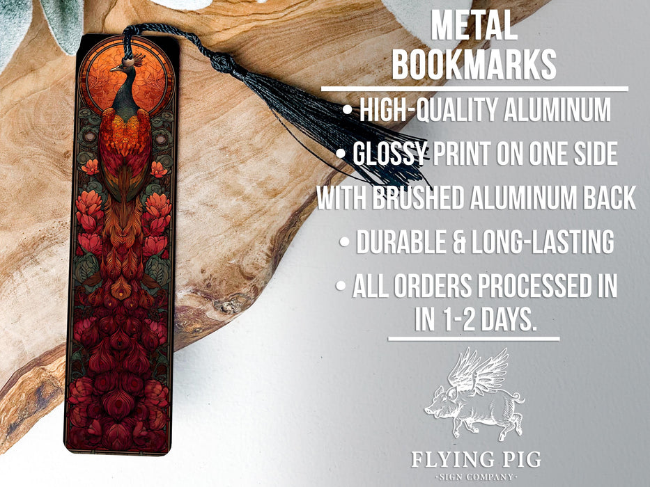 a metal bookmark with a detailed design, placed on a wooden surface.