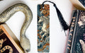 a decorative snake-shaped bookmark with a unicorn illustration on it, placed next to a book titled "Practice".