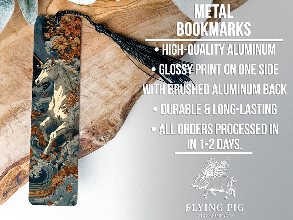 a metal bookmark with a detailed illustration of a unicorn on it, placed on a wooden surface.
