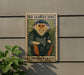 a poster of a red-shanked douc, a type of primate, hanging on a wall.