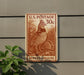 A U.S. postage stamp featuring a ruffed grouse, which is a type of bird, is mounted on a wall.