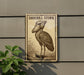 a sign with a stork illustration on it, mounted on a wall next to a plant.