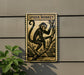a sign depicting a spider monkey, which is mounted on a wall.