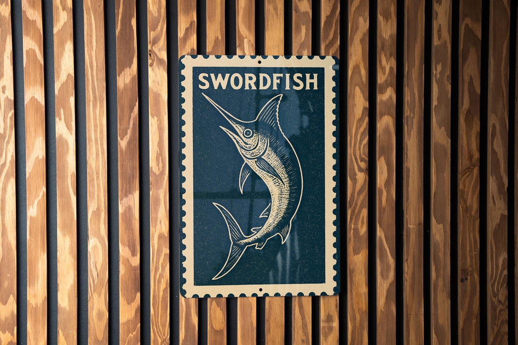 A metal sign with the word "SWORDFISH" printed on it, mounted on a wooden wall.