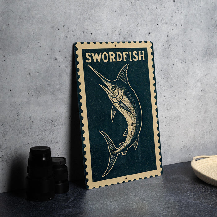 a metal sign with a swordfish illustration, placed on a table next to some black camera lenses.