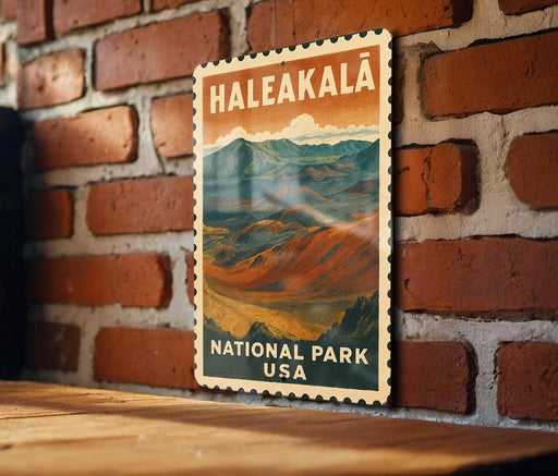 A vintage-style metal sign with the text "Haleakala National Park USA" displayed on a brick wall.