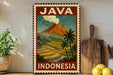 A vintage-style poster of Java, Indonesia, featuring a mountain with a plume of smoke rising from it, surrounded by palm trees and rice fields.