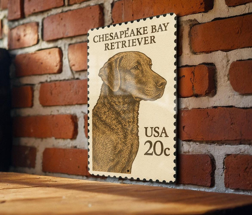 A wooden table with a framed image of a dog, specifically a Chesapeake Bay Retriever, on it.