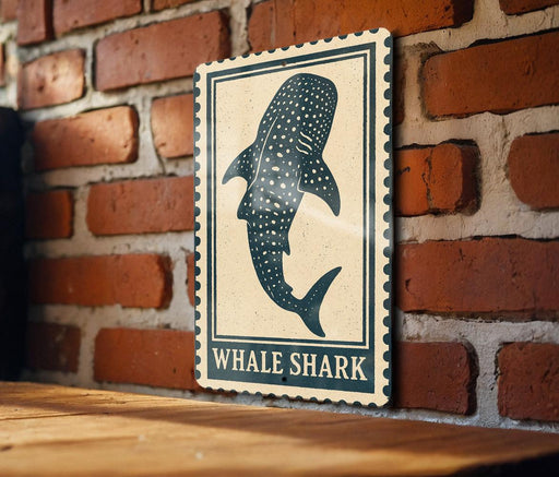 a wooden table with a framed sign depicting a whale shark.
