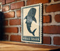 a wooden table with a framed sign depicting a whale shark.