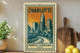A vintage-style postage stamp depicting the Charlotte, North Carolina skyline, with a wooden cutting board and lemons in the foreground.