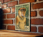A wooden table with a brick wall in the background, and a framed illustration of a proboscis monkey on the wall.