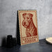 A framed poster of a Terrier dog, specifically a Lakeland Terrier, is displayed on a wall.