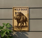 a sign with a picture of a wild boar on it, mounted on a wall.