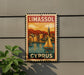 A vintage-style sign for Limassol, Cyprus, featuring a sailboat on the water and a cityscape in the background.