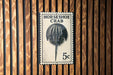 A black and white stamp-like sign with the text "HORSESHOE CRAB" and a detailed illustration of a horseshoe crab.