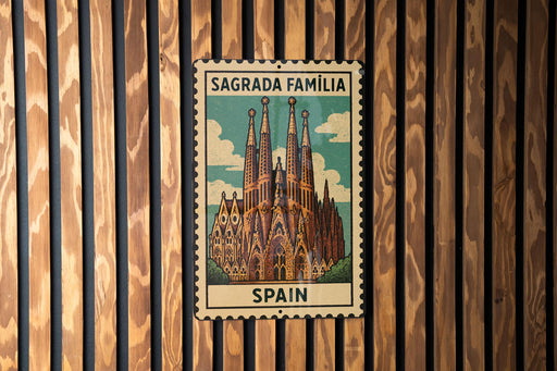 A metal sign with a picture of the Sagrada Familia, a famous cathedral in Barcelona, Spain.