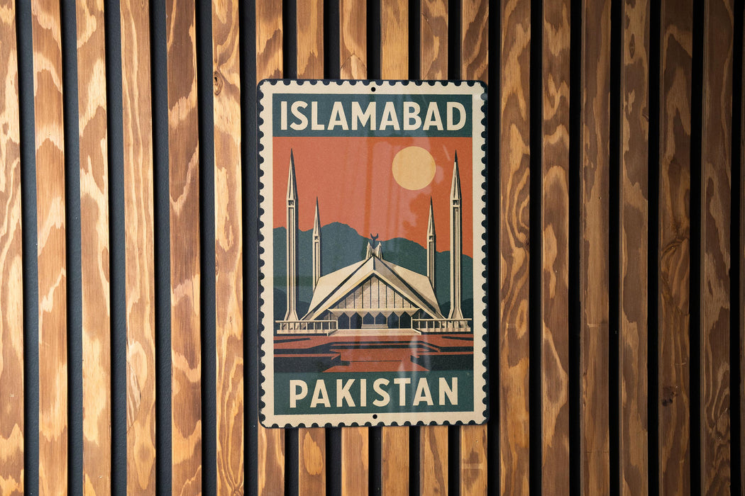 A vintage-style metal sign with the text "ISLAMABAD PAKISTAN" displayed on a wooden wall.