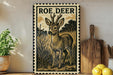a decorative metal sign with a deer illustration, placed on a wooden surface next to a potted plant and a wooden cutting board.