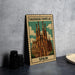 A metal sign with a colorful illustration of the Sagrada Familia, a famous Roman Catholic church in Barcelona, Spain.