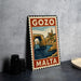 A metal sign with a vintage-style illustration of Gozo, Malta, featuring a castle and a bridge over a body of water.