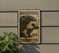 A metal sign with a hedgehog illustration and the text "HEDGEHOG USA FOREVER" is mounted on a wall.