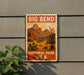 A vintage-style sign for Big Bend National Park, featuring a desert landscape with mountains and cacti, mounted on a gray wall.