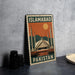 A metal sign with the text "ISLAMABAD PAKISTAN" and an illustration of the Faisal Mosque, a famous landmark in Pakistan.