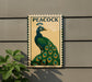 A decorative metal plaque featuring a colorful illustration of a peacock, with the word "PEACOCK" prominently displayed.