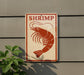 a sign with a red shrimp illustration on it, mounted on a wall.