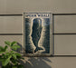 a sign with a picture of a whale, mounted on a wall.