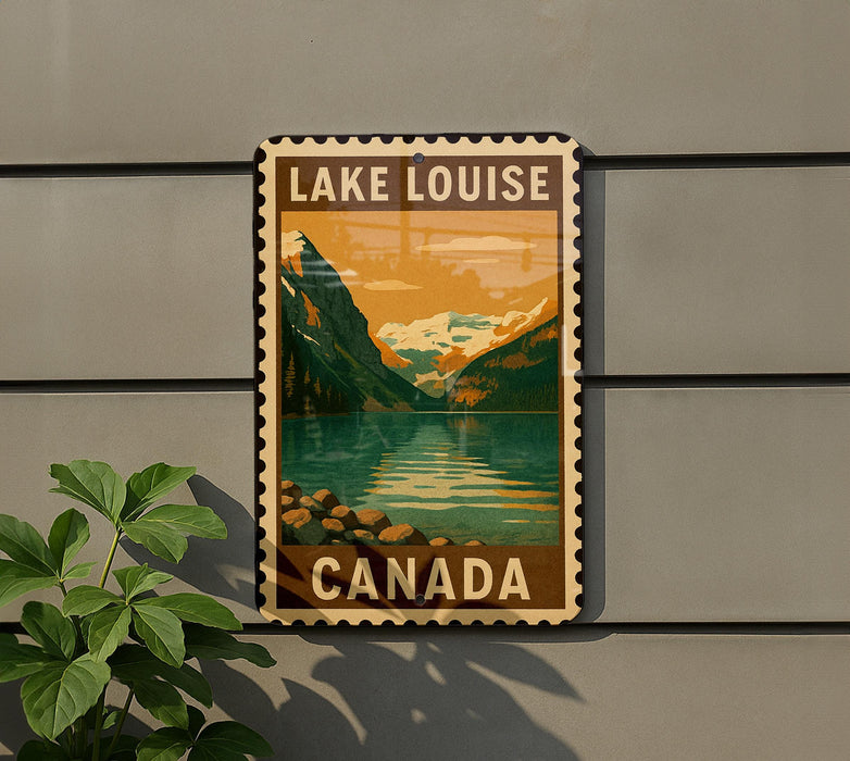 A vintage-style poster of Lake Louise, a famous mountain range in Canada, is displayed on a wall.