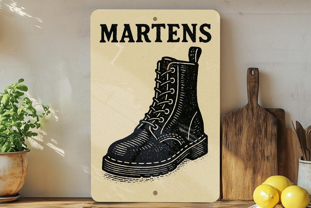 a wooden sign with a black and white illustration of a black boot, placed on a wooden surface next to a wooden cutting board and a potted plant.