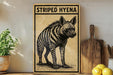 a wooden sign with a black and white illustration of a striped hyena, placed on a wooden surface next to a wooden cutting board and some lemons.