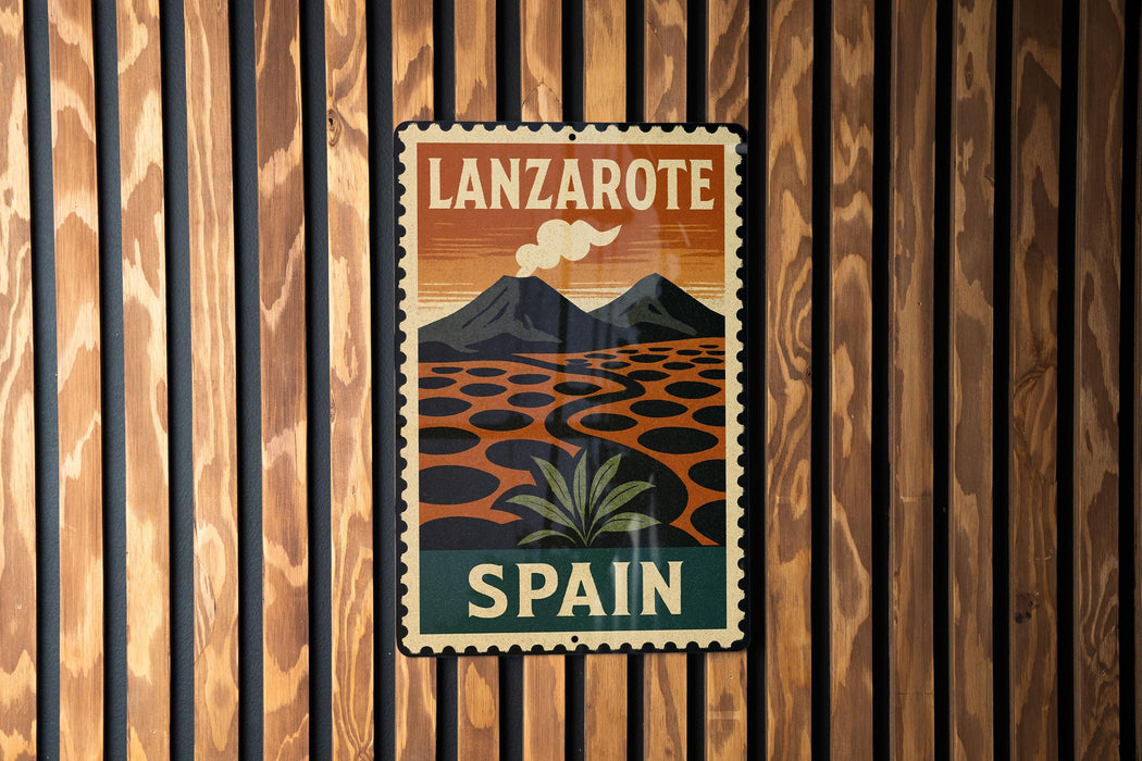 A vintage-style metal sign with the text "LANZAROTE SPAIN" displayed on a wooden wall.