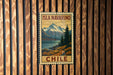 A vintage-style metal sign with the text "ISLA NAVARINO CHILE" is displayed on a wooden wall.