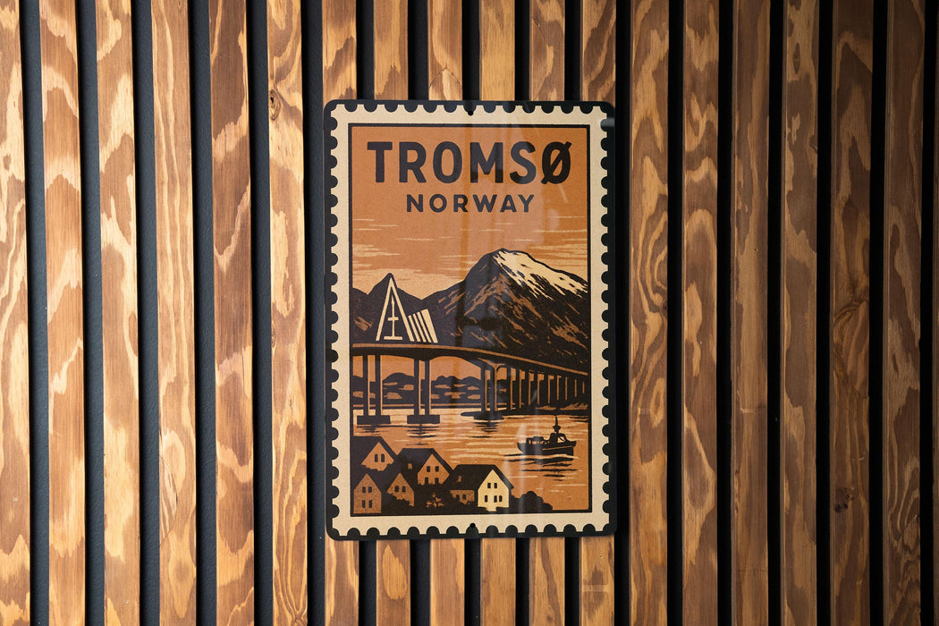 A vintage postage stamp featuring a scenic image of a bridge and houses, with the text "TROMSO NORWAY" prominently displayed.