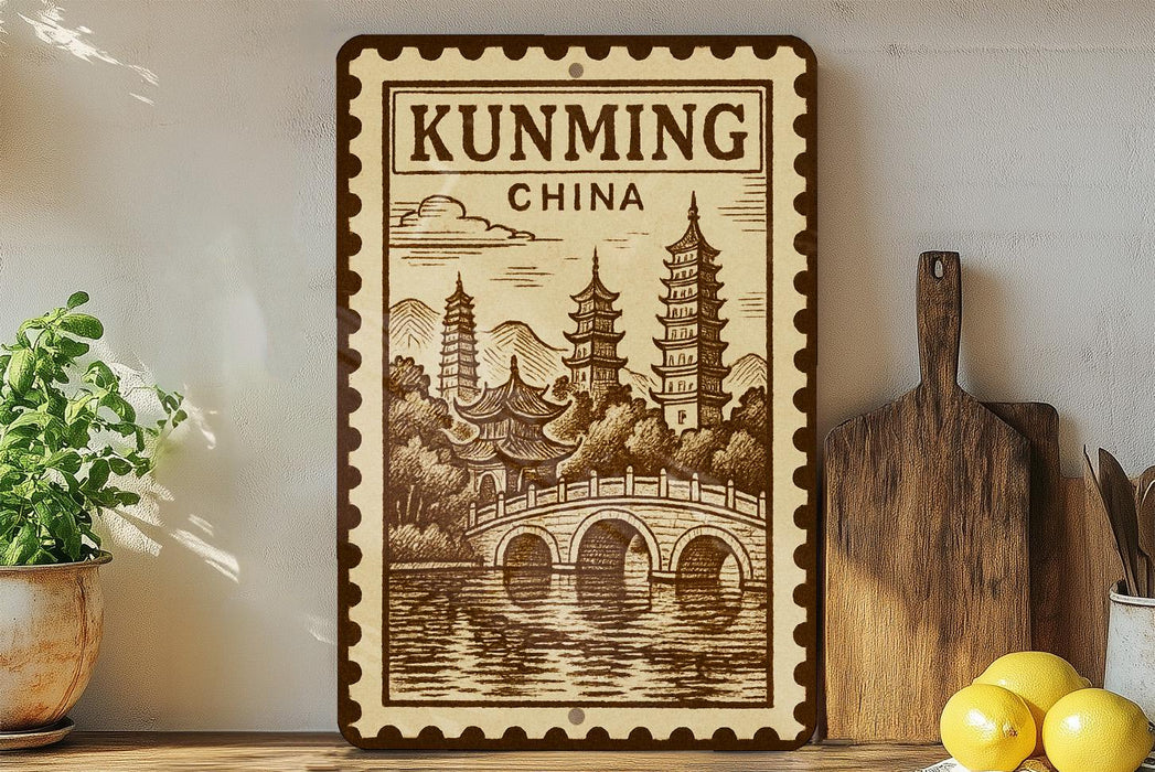 a decorative sign with a traditional Chinese temple illustration, placed on a shelf next to a wooden cutting board and some potted plants.