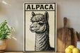 a wooden cutting board, a potted plant, and a sign with an illustration of an alpaca.