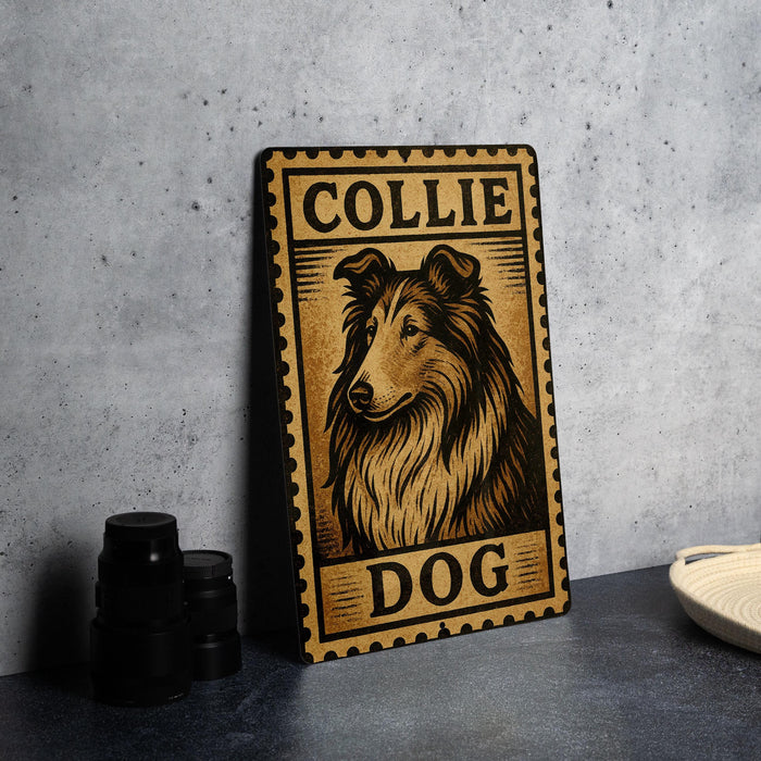 A metal sign with a collage of images depicting a collie dog, along with the text "COLLIE DOG" on it, is displayed on a table.