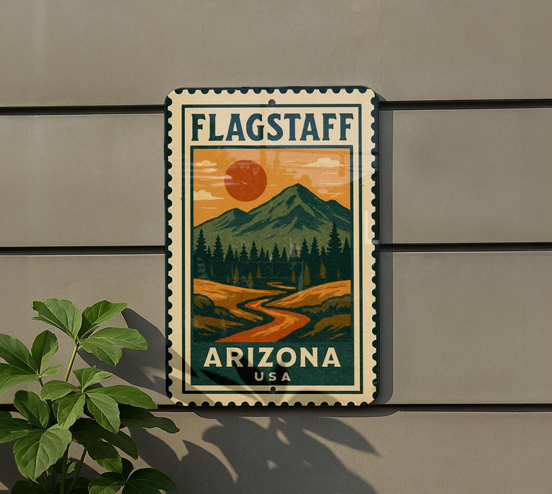 A vintage-style metal sign with a mountain landscape and a sun in the sky, mounted on a wall.