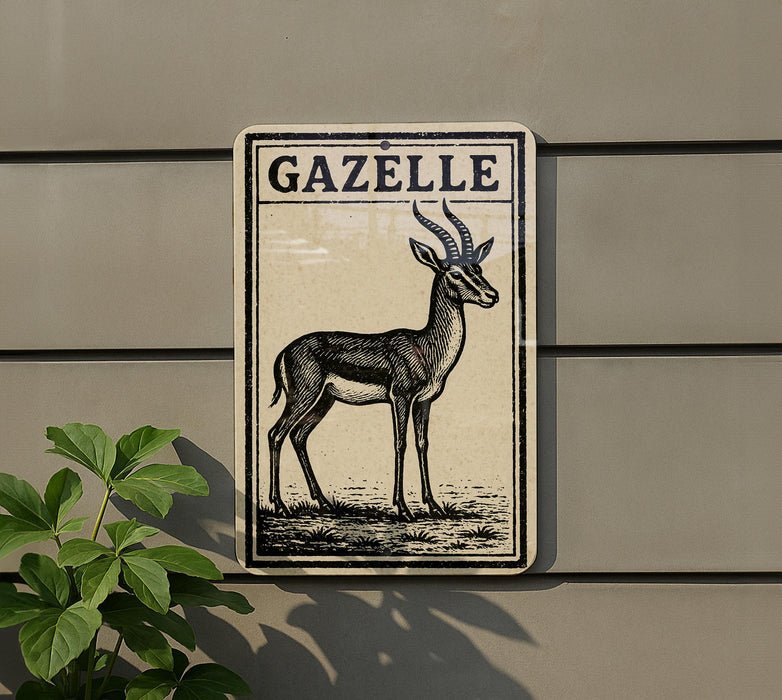a sign with a black and white illustration of a gazelle, mounted on a wall.