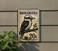A metal sign with a kookaburra illustration and the text "KOOKABURRA 20c" is mounted on a wall.