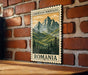 a vintage-style postage stamp with a mountain landscape and pine trees, mounted on a brick wall.