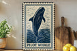 A framed illustration of a pilot whale is displayed on a shelf, accompanied by a wooden cutting board and a potted plant.