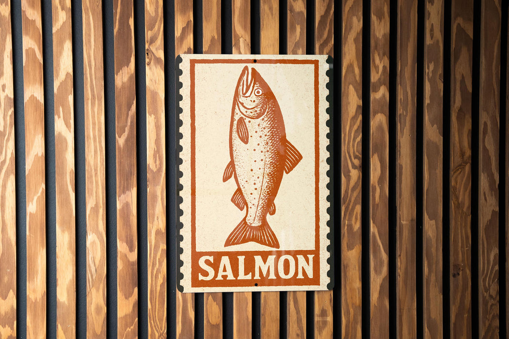 a sign with a fish illustration and the word "SALMON" written below it.