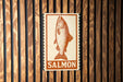 a sign with a fish illustration and the word "SALMON" written below it.