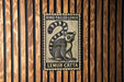 A black and white stamp featuring a lemur, with the text "RING-TAILED LEMUR" and "LEMUR CATTA" printed on it.