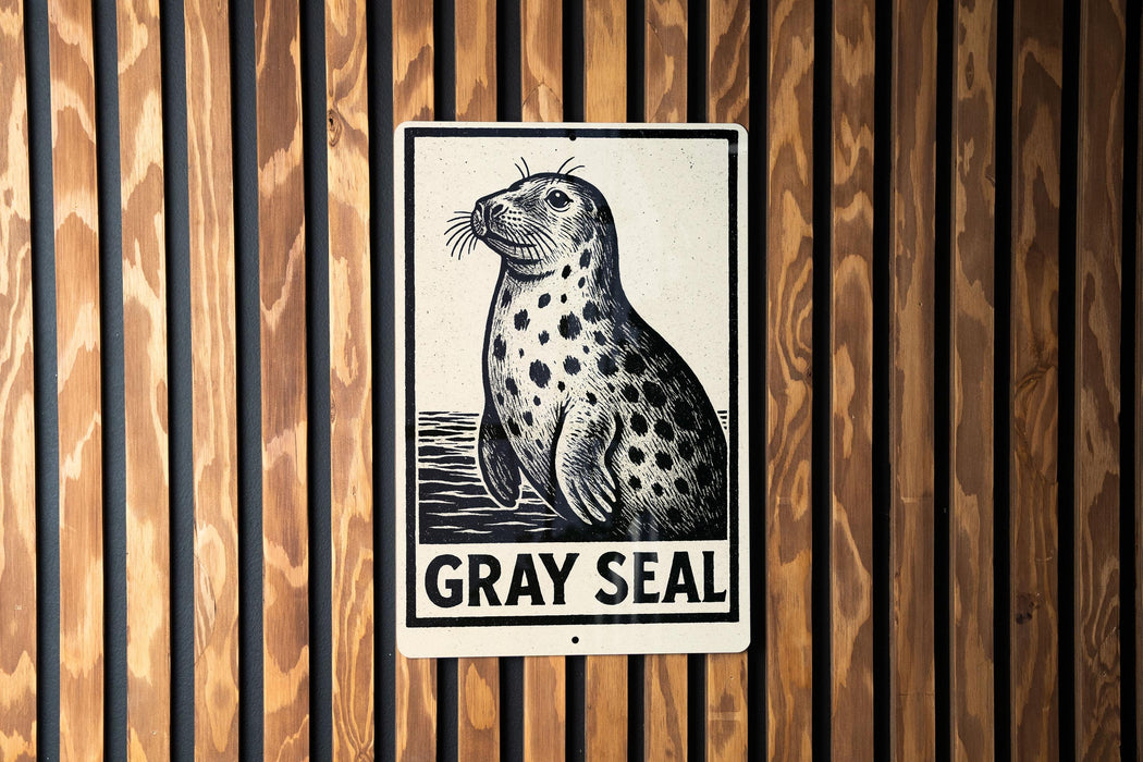 A sign featuring a black and white illustration of a seal, with the text "GRY SEAL" below it.