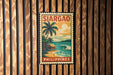 A vintage-style poster of Sargao, a tropical island in the Philippines, is displayed on a wooden wall.